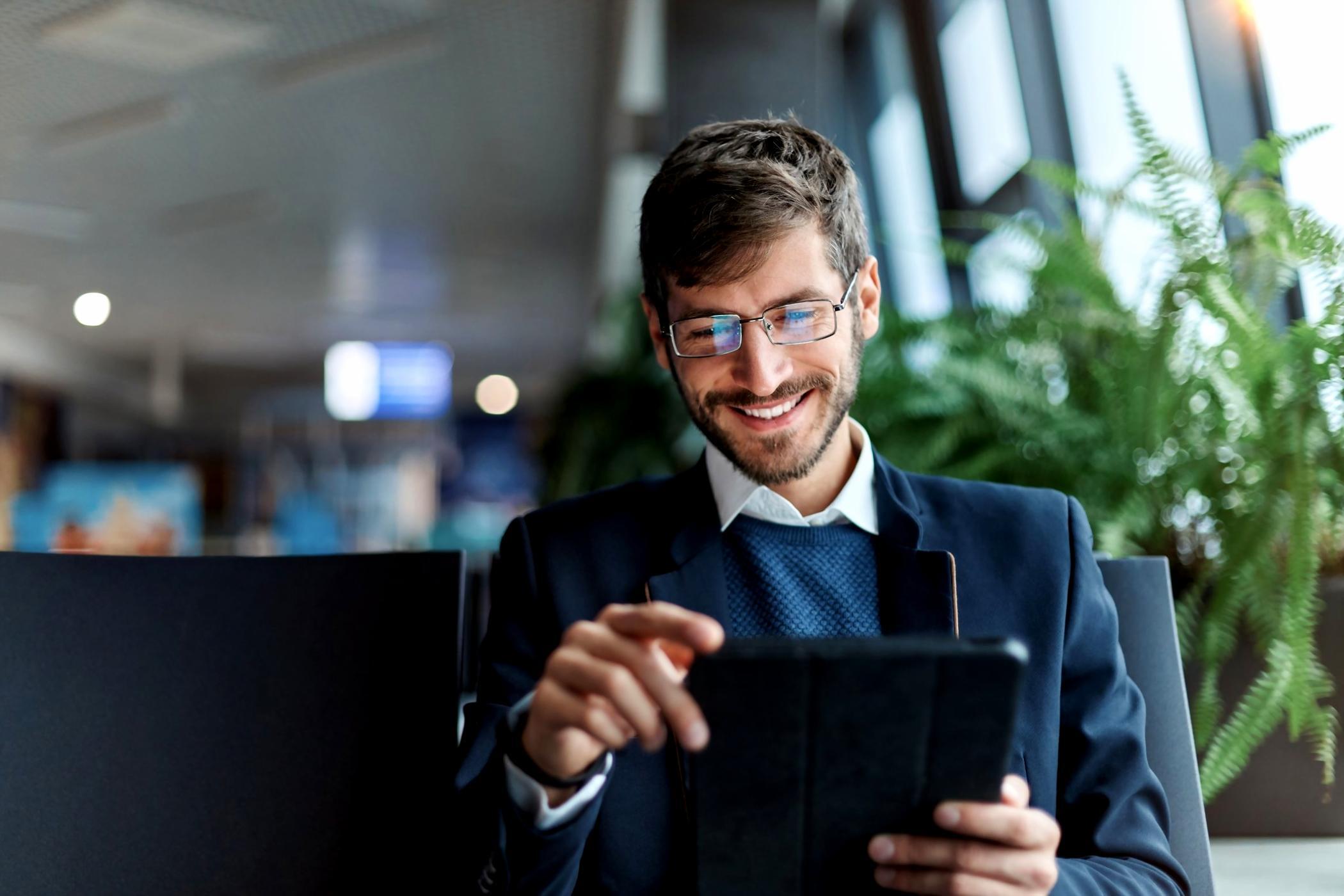 Team workspace with multiple monitors showing interface design work